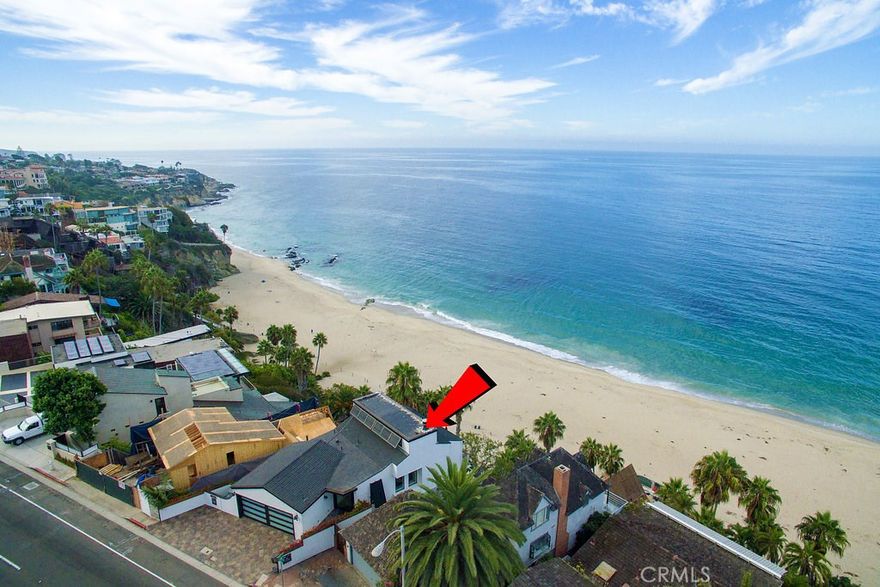 Oceanfront Home with private steps to the sand and your own private beach above the median high tide line.  Spectacular, unobstructed views of beach, sand, surf break, crashing waves on rocks and Catalina Island. Entire exterior renovation of the home  just completed - Modern Cottage style - White with Black trim and Shutters!  Brand new pivoting glass front door.  New glass paneled garage door. Parking for 7 cars!!  Three large view decks all newly refurbished with brand new awnings.  Sitting Room off the Master with fireplace and new European Oak Plank flooring. Great Room includes a Living Room, Dining, Kitchen and Large Deck, all with full Ocean & Beach views. Another sitting room off the 2nd bedroom with its own serene patio with comfy lounge area for reading or relaxing after a day down on the beach.  The 3rd bedroom suite on the bottom floor also has its own sitting room and access to the largest balcony connecting to your own private staircase to the beach.  Located in South Laguna at Thousand Steps Beach.