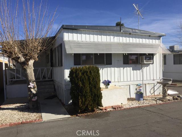 2 Bed 1 Bath Magnolia Model in gated 55+ community. Approximately 950 sq. ft. of living space includes a separate indoor laundry with topover washer/dryer with gas and elecric. Newer gas range/oven, dishwasher, microwave and refrigerator. Water softenening system with purified drinking water tap at kitchen sink. There is a second 'shower only' bathroom as well. Newer carpet and laminate indoors. Outside includes 8 x 16 covered front porch, a 7 x 7 back porch with wheelchair access ramp alongside driveway, and a covered patio area behind the laundry room. Outdoor shed for extra storage too. Association Amenities: Carport, Laundry # of RV Spaces: 0 Special Features: Storage ShedPART,NONE Lot Location Type: Standard Location FireplaceFeatures: None Pool Features: Common Pool Spa Features: Common Spa Zoning: Residential 1 # of Attached Spaces: 0 # of Detached Spaces: 0 # of RV Spaces: 0