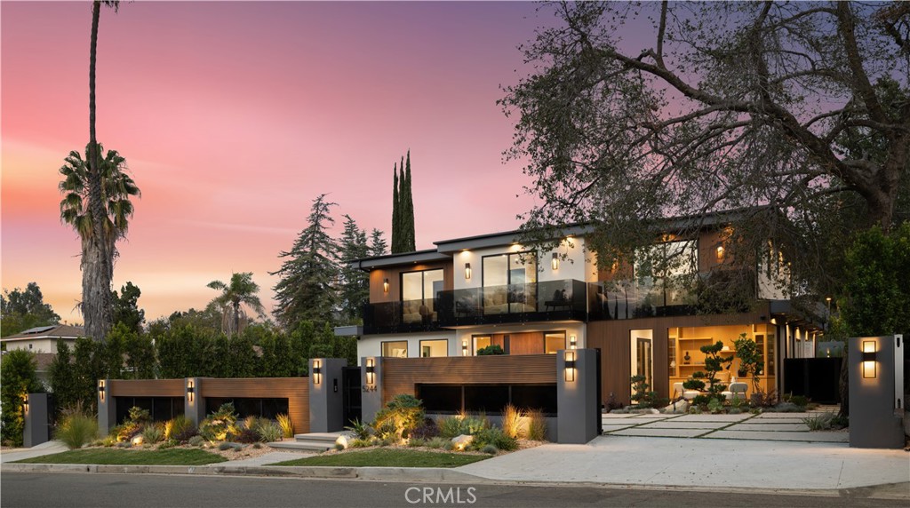 Stunning Private Estate South of the Boulevard located in one of the most desirable neighborhoods south of the boulevard, this exceptional private gated estate offers the perfect blend of modern design and luxurious living. Set on beautifully landscaped grounds, the home boasts 5 bedrooms, 7 bathrooms, a study, a media room, and an array of high-end amenities that make it an entertainer's dream. The open floor plan creates a seamless flow between the living spaces, making it ideal for both intimate gatherings and large-scale entertaining. The chef’s kitchen is a culinary masterpiece, featuring Wolf and Sub-Zero appliances, a large center island, quartz countertops, a breakfast area, and a Miele coffee maker. The romantic primary suite serves as a serene retreat with a cozy fireplace, a spa-like bathroom, a large walk-in closet, and two private balconies. Additional highlights include 6 fireplaces throughout the home, a Crestron smart home system, Fleetwood pocket doors, integrated indoor and outdoor speaker systems, and security cameras. The exterior is just as impressive, with lush landscaping, a large reverse infinity pool and spa, a pool house, and a fully equipped outdoor kitchen with a 5-burner stove, BBQ, and beverage refrigerator. A covered patio with dual fireplaces is perfect for year-round entertaining and relaxation. For active pursuits, there’s a lighted sport court and a putting green, ensuring there’s something for everyone. Other standout features include a detached garage with ample parking space for luxury vehicles, RVs, and tour buses, as well as room for 10+ additional cars. The property is fully equipped with solar panels and underground utilities for enhanced sustainability. This home offers unparalleled privacy, comfort, and style, making it an ideal sanctuary for those seeking the ultimate in luxury living.
