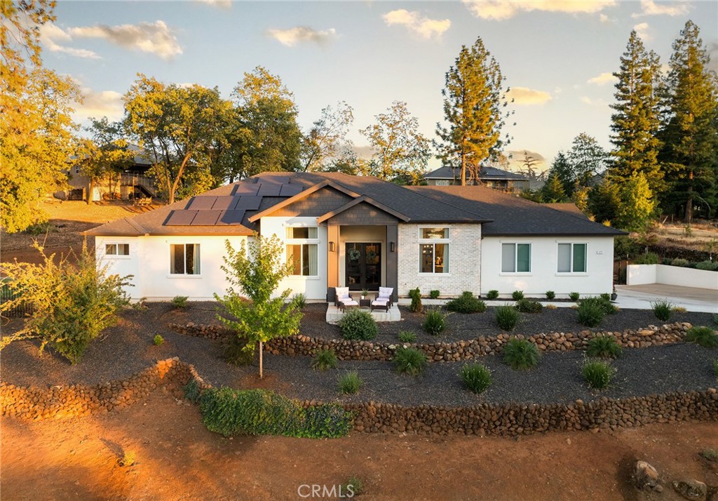 Experience luxury resort living with true energy independence in this upgraded west side Paradise home, now offered under market value! Designed for comfort, sustainability, and style, this property features a heated saltwater pool with built-in spa and waterfalls, a fully landscaped entertainer’s backyard, and an outdoor sauna for year-round relaxation. A Tesla solar system paired with two Powerwall backup batteries delivers resilience and significant savings, with an assumable $413/month solar loan that helps avoid typical $1,200+ utility bills. Inside, enjoy soaring 12-foot ceilings, custom lime-washed walls with a Venetian plaster finish, a grand entryway, and a chef’s kitchen complete with a 36” range, wall oven, and generous counter space. The spacious primary suite offers dual walk-in closets, a soaking tub, walk-in shower, and direct access to the backyard oasis. Ideal for entertaining or peaceful living, the backyard includes a custom Natural Design pool, multiple waterfalls, room for gardening or chickens, and more. Located just minutes from shopping, parks, and a quick commute to Chico via Skyway, and boasting over $200K in premium upgrades, this is a rare opportunity you don’t want to miss—schedule your private showing today.