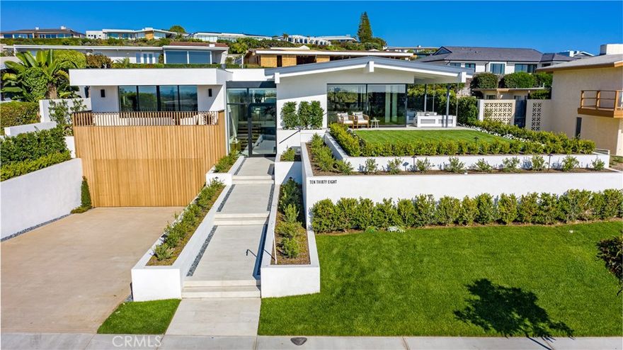 An Acumen of Magnificence. Patterson Custom Homes presents this signature residence favorably positioned on one of Corona del Mar&#8217;s superlative lots with premium harbor and ocean views. The luxe residence was painstakingly designed to optimize indoor outdoor living by indulging in an open floor plan where main level common areas open to the pool, yard, and views of the ocean and beyond through a series of sliding and disappearing doors. Great attention to detail is observed in the home&#8217;s oversized bedrooms and closets, the use of light wells to enhance illumination throughout, and modern conveniences and amenities such as an elevator, entertainer&#8217;s hub, and 4 car-garage. Applying a timeless concept and contemporary twist on mid-century modern, this property stands as another example of why the demand is so great for this preferred builder and the customized luxury concierge services that are provided for a lifetime. From hiring prime subs, to electing famed architects and perceptive designers, Patterson intimately builds each home with the finest in finishes and distinct appreciation to the consumer advantage. The impressively appointed home is an illustrious addition to the company&#8217;s thriving and notable portfolio. With nearly two decades of an evolving and leading reputation, Andrew Patterson has curated an unparalleled experience to purchasing a quality, new-construction property.