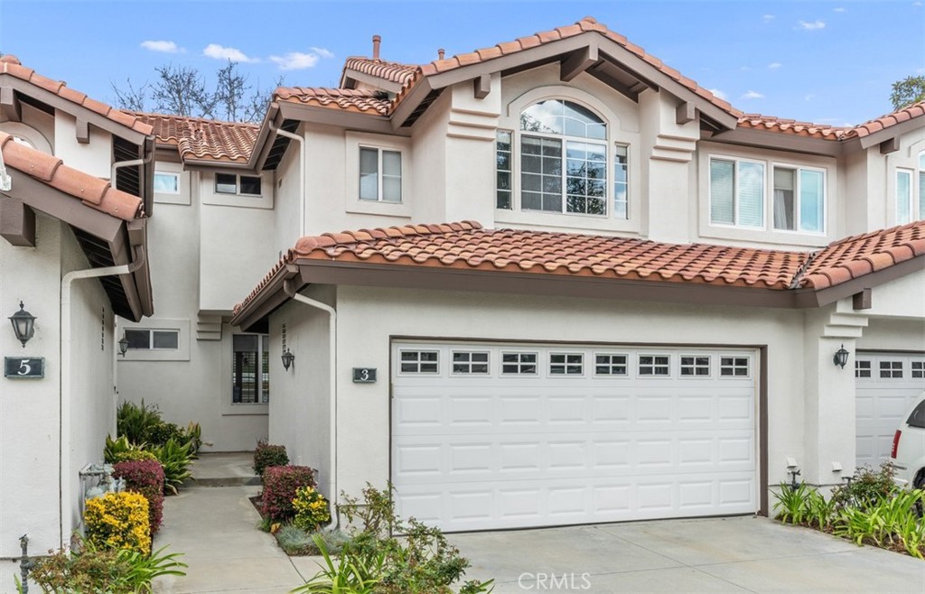 Brand New Listing in the heart of RSM! Located in the Candelero neighborhood near award winning Tijeras Creek Golf Club is this beautifully updated 2 story townhome with TWO spacious primary suites and a powder room downstairs. As you enter the home, you'll notice the soaring ceilings in the living room, freshly painted white walls, and light tile flooring, giving it a fresh and open feeling. Located in the formal dining and living area is a cozy fireplace and sliders leading to your backyard oasis. Adjacent is the beautifully remodeled kitchen with sparkling white cabinets, stainless steel appliances, newer quartz countertops, fresh tile backsplash, can lights, 5 burner stove, dining area and breakfast bar, and a second set of sliding glass door leading to your backyard oasis making this the perfect home for indoor/outdoor entertaining! The backyard has beautiful plantings around the perimeter, paver tiles on the patio, and string lights surrrounding the space giving it a resort type feel and no neighbors behind! Upstairs you'll find the 2 large primary suites both with en suite bathroom areas that have been partially updated. One of the suites has a cathedral ceiling with fan and a single sink in the bathroom with fun tilework in the shower, and the other primary has dual sinks with custom neutral tone tilework in the shower/tub area. Other amazing features of the home worth mentioning is the attached direct access 2 car garage, which has a roll up door, epoxy flooring, electrical hookup for a Tesla charger, an abundance of storage, washer/ dryer hookups, and a 2 car driveway which is a rare find! Also, the home has many "smart" features including light switches, nest thermostat and garage door opener, as well as a walk-in downstairs coat closet. Within the Candelero community is a pool and spa, paved walking trails with canyon views galore, and playground close by for the kiddos. RSM boasts the presence of many community events each year, a community center with classes held throughout the year, many sport courts including pickle ball, parks, 4 swimming pools, the Beach Club/ Lagoon, theater, nearby shopping options like Trader Joe's, Target, Lowes, and other major grocery stores, many dining choices, fitness facilities, O'neill Park with its abundance of natural trails and wildlife, and so much more! RSM is consistently at the top of the list as one of the safest cities in California! The best OC has to offer!