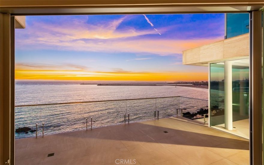 Breathtaking ocean views and walls of glass hanging over the waves, tidal pools, and Newport

Beach Harbor entrance distinguish this near 7500 square foot exquisitely built home on the most

prestigious section of Ocean Blvd. Seven years from design through completion with extensive

concrete construction and caissons ensures this home is built to last a lifetime. Few homes along

the entire California coast can match the sunset views from every room and the charming village of

Corona Del Mar is just steps away offering fine restaurants and quaint shops. This ¨smart¨ home

with the finest limestone, custom finishes, designer lighting and high security offers every luxury

imaginable from home theater through climate controlled wine cellar. The unique cliff side location

allowed construction not possible today and the community of Corona Del Mar offers an

unparalleled luxury lifestyle known for safety and elegance for a select few.