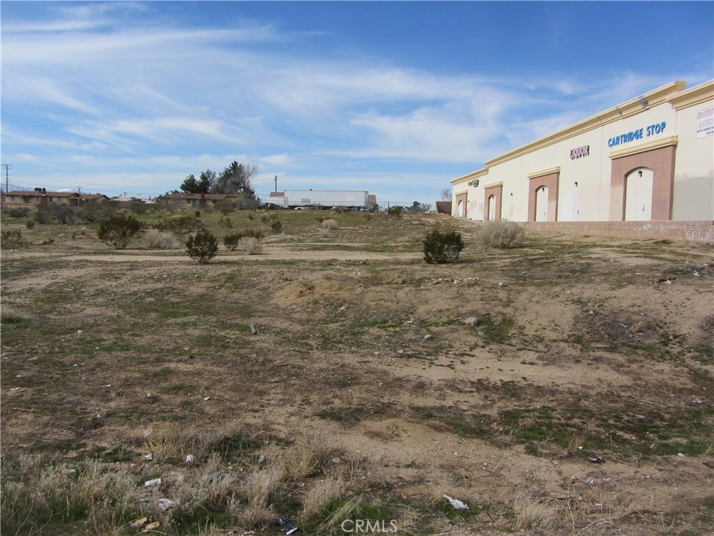 OWNER FINANCING AVAILABLE! Commercial lot on heavily traveled Hesperia Rd. This parcel has excellent development potential with close proximity to Bear Valley Rd. Location is right next to an existing commercial center. Buyer to verify all zoning and utilities. Owner may carry - terms negotiable.