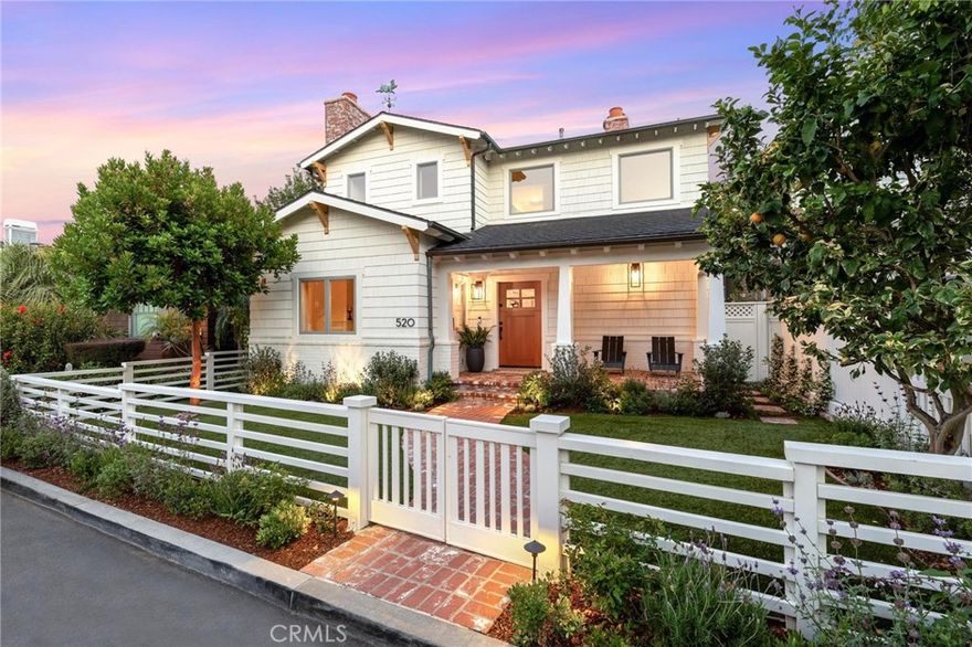 Welcome to 520 21st Street, an exceptional, recently remodeled Cape Cod home that perfectly blends timeless charm with modern amenities. On the market for the first time in twenty years, this thoughtfully designed residence sits on an oversized 3,592 square foot lot along a prime Gas Lamp street. Just moments from the beach, parks, and downtown Manhattan Beach, it offers a seamless flow for both entertaining and everyday living. Entering through the gated yard, a porch and an inviting sitting area warmly welcome you home. Off the entryway, the living room features a cozy fireplace, large picturesque windows to the front yard and flows into the formal dining room. Continuing through the home, the dining room opens to the spacious kitchen, equipped with Viking stainless steel appliances, abundant storage, and an oversized island with breakfast bar seating. The kitchen space also offers a separate bench breakfast nook providing space for more informal dining. Adjacent to the kitchen, the open-concept family room boasts an exposed brick fireplace and direct access to the backyard; a perfect indoor-outdoor connection. The main floor also includes a stylish powder room, access to the garage and a rear staircase leading conveniently to the upper level of the home. Ascending upstairs, the primary suite features a vaulted wood-slatted ceiling, a fireplace, and a spacious walk-in closet. The spa-inspired ensuite includes a dual vanity, a separate water closet, a free-standing tub, and a large glass shower with a rainfall showerhead. French doors lead to a private terrace, perfect for enjoying serene mornings or peaceful evenings. The second level also includes a versatile workspace, ideal for a home office, homework station or creative projects. A junior suite offers high ceilings, an ensuite bathroom with a large glass shower, and its own private terrace. Two additional bedrooms, each with custom built-ins and ample closet space, share a thoughtfully designed Jack-and-Jill bathroom. Completing this level is an upstairs laundry room for added convenience, along with scenic greenbelt views. Step outside to the backyard space, where a barbecue bar and firepit area provide the ultimate setting for entertaining family and friends. Direct access through the rear family room seamlessly amplifies transitional living between the outdoors and inside the home. Additionally, discover wide plank oak floors throughout and a double-car garage ensuring ample storage and parking.