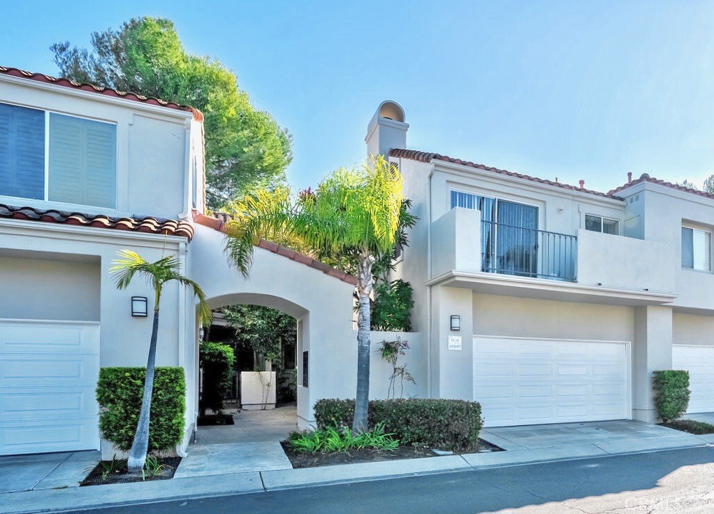 Beautiful 2 bedroom, 2.5 bath townhome with large private back patio in the desirable Encore community of Marina Hills. This move-in ready home has a bright open floorplan with high ceilings and an easy flow between the kitchen, dining and living room areas. The kitchen has been remodeled with new quartz countertops, a stainless steel sink, upgraded fixtures, tray ceiling and a L-shaped island with counter seating. Quality features include new paint, new wood laminate flooring and carpet, crown molding, recessed lighting and a 3-sided fireplace. Two large sliding glass doors lead to a hardscaped backyard, great for entertaining and relaxing as you look out onto a community greenbelt/hillside with lush landscaping. Main level includes a powder room and separate laundry room with direct access to the 2 car (side by side) garage with plenty of storage. Both upstairs bedroom are spacious with high vaulted ceilings, mirrored closet doors, wood shutters and are en suite. Plus the master bedroom has a private walkout balcony with city views. Bathrooms feature granite counter tops and shower/tub combinations. This home has been re-piped with PEX piping. Association amenities are abundant and include the Encore pool and spa and neighboring Park Vista Park, which consists of a playground and open grass area with extensive views of the surrounding hills. The Marina Hills Community clubhouse offers a full-kitchen and fireplace adjacent to the pool area, a 75 ft. Junior Olympic size swimming pool, wader pool, spa, showers and restrooms. There are barbeque areas, 6 tennis courts and pickleball courts. A walking path off Parc Vista leads down to Salt Creek Trail by which you can walk all the way to Salt Creek Beach. Marina Hills Park has soccer fields, basketball courts, bocce ball courts, picnic tables and a play structure. Conveniently located near shopping, dining, hiking and biking trails, public and private schools, local beaches and the harbor.