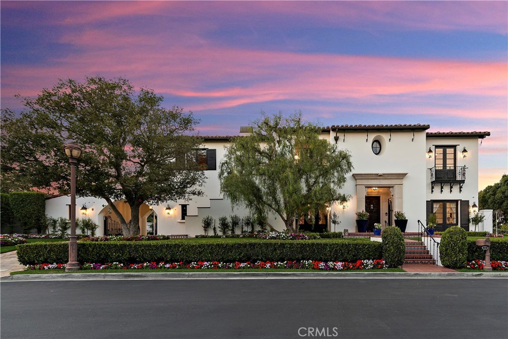 An Exquisitely custom estate located in the exclusive guard gated community of One Ford Road. 1 Troon is only one of 8 magnificent custom estates located on Troon Drive. This California Spanish style estate boasts of 8,206 sq-ft of indoor-outdoor living space embellished with custom tile-work and imported hand hewn beams. This home situated on a spacious 17,424 sq. ft. corner lot featuring 6-bedrooms, 6-bathrooms, fully-equipped chef’s kitchen and butler’s pantry, wine room, formal dining room, a great room that overlooks an entertainer’s dream backyard with pool, media room, gorgeous master bed and master bath, his and her closets, multiple laundry rooms, and much more. 1 Troon Drive is a true entertainer’s residence that will undeniably take your breath away. This flawless one of a kind estate is the quintessential place to call home.