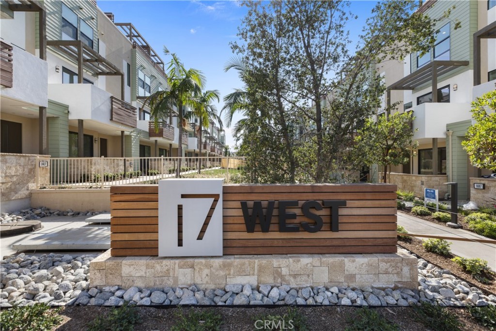 Sleek, modern, luxurious and wonderfully light and bright, this home situated on a private road in the prestigious 17 West Community is a rare find. Enter through the front door to a private bedroom/office with a full bath. Proceed upstairs to where contemporary opulence awaits in its open great room, featuring living and dining rooms and an upscale modern kitchen in center. The kitchen is appointed with an oversized quartz island and countertops, an oversized sink, porcelain subway tile backsplashes and premium stainless-steel appliances. Dual primary suites await on the third level, with spacious walk-in closets, private on-suite baths as well as a laundry closet. Walk up the stairs to the top level and prepare to be taken in by its large sky suite and rooftop lounge to enjoy sunsets, fresh air, fireworks and the sounds of a bustling urban beach community. This home is equipped with a water purification system and conveniently located close to historic downtown Costa Mesa and Newport Beach and a short drive to Fashion Island and the John Wayne Airport.