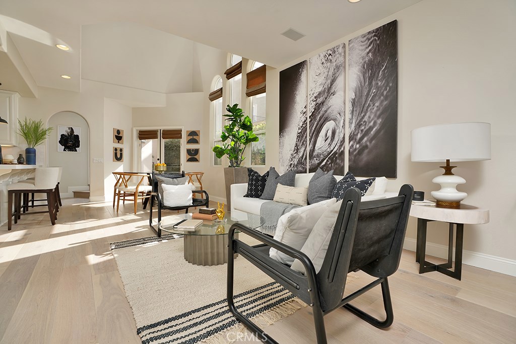 Newly renovated and refreshed, 412 Acacia is a front unit featuring Catalina & Harbor views, A prime location south of PCH and only 3 houses from the bluff front of Pacific drive and Begonia Park. You are greeted with a generous patio featuring a lovely fireplace that is perfect for entertaining. French doors lead to a spacious open floor plan with dramatic high ceilings and plenty of windows allowing an abundance of natural sunlight to flood in & brighten up the main living area and highlight the new wide plank oak flooring. Gourmet kitchen with Viking 4-burner and griddle, Bosch dishwasher, built in refrigerator & new white quartz counters, and Walker Zanger tile are just a few of the kitchen highlights. Upstairs is the guest bedroom with full bath and Master Retreat with a unique two-sided fireplace & private balcony. A third loft-style bedroom, with adjacent full bath, has access to the rooftop deck with Catalina, and Harbor views. Situated on a quiet street near excellent schools, shopping, great restaurants and the beach, this home is in the heart of Corona del Mar, the perfect place to enjoy SoCal living in one of the most prestigious communities in Orange County.