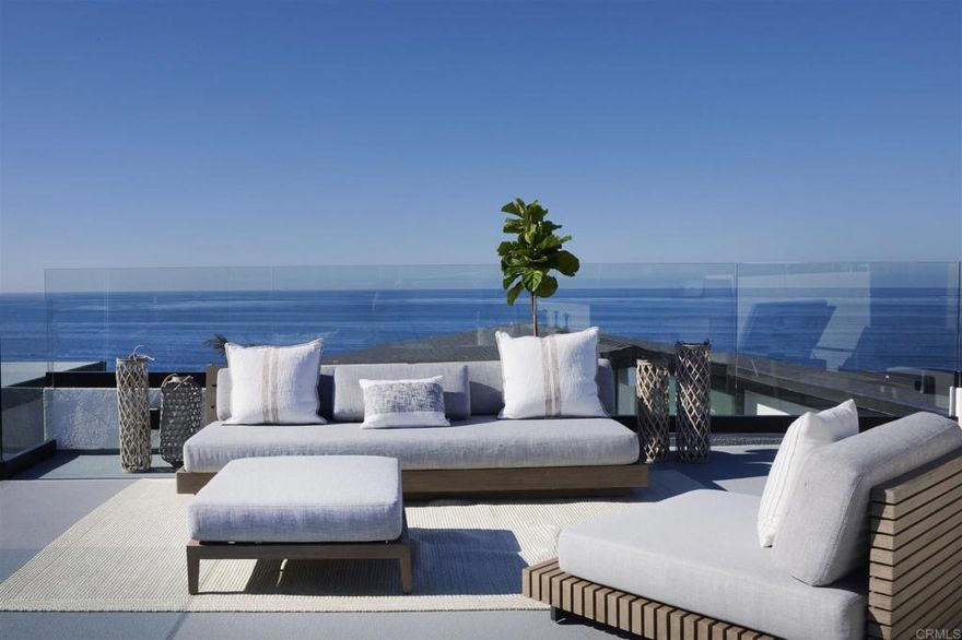 Perfectly situated, gorgeous breathtaking panoramic views of shimmering surf, sea, sunsets, coastline, wildlife and nightlight are yours in this La Jolla brand newly reconstructed state of the art 4+ bedroom, 4 ½ bath contemporary home. Located across the street from the beach and ocean of Bird Rock capturing rare unobstructed views over the pacific to Point Loma, Coronado, San Diego and the North County coastline, all while enjoying the La Jolla beach lifestyle. A short stroll to Bird Rock Village, shops and restaurants, the home boasts great entertaining and living areas throughout, as well as private spaces in which to relax and take in the Southern California lifestyle. This home is complete with three levels of decks, oversized glass windows and sliding doors, stunning vistas, a sun filled and state of the art entertainer’s dream kitchen with stone finished counters and expansive island with bar seating opens to the living room with high ceilings and a gorgeous fireplace. On the top of this masterpiece is a full outdoor viewing deck complete with an outdoor kitchen, bbq, lounge and bar seating as well as unobstructed 360 degree views and priceless sunsets. The main floor west facing luxurious ocean view master bedroom retreat is complete with a fireplace, walk in cedar closet and a spa like master bathroom. Additionally, the main floors’ en-suite bedroom has its’ own private patio and is tucked away enabling serenity and comfort. This home is complete with a separate office, laundry room, oversized game room/family room with kitchen, third fireplace and glass wall of sliding doors to one of the three west facing view decks. There are two additional exquisite bedrooms with unobstructed views adjacent to this living space. There is an attached two car garage which opens onto a private one way in and out road shared only by a handful of surrounding neighbors.  This home truly embodies the quintessential yet sophisticated La Jolla beach style.   www.5527calumet.com