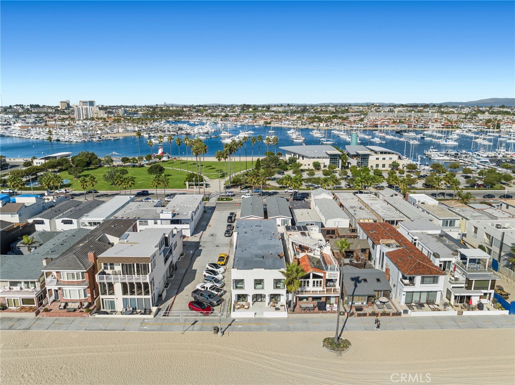 Unique opportunity to own a fully renovated 11 unit oceanfront vacation rental property that feels like a first class boutique hotel. Welcome to 1628 West Oceanfront, with nine highly sought-after short-term rental permits make it easy to experience investment returns with a projected 4.3% cap rate, create a personal residential compound, or live in one unit and rent the rest. Located on the Balboa Peninsula between the Newport and Balboa piers, the property occupies a large 35' corner lot, giving it more visibility and added privacy with only one direct neighbor. Panoramic views encompass golden sands, the Pacific Ocean, dramatic sunsets, Catalina Island and the Orange County coastline. A beach-front entrance leads to a variety of rooms that includes seven studios; two two-bedroom, one-bath designs; and two one-bedroom, one-bath designs. Depending on the room, guests will enjoy a kitchenette or dine-in kitchen, sitting rooms, ocean-view patios, and luxurious freestanding bathtubs. Every room showcases luxury vinyl plank flooring, soothing white and gray color themes, quartz countertops, Shaker cabinetry, recessed lighting, dual-pane windows, and custom tile work. Marina Park, which features a playground, picnic areas, a beach and basketball courts, is only one block away. Fashion Island shopping and dining, the Balboa Fun Zone, Balboa Island, golf, biking paths and more are all just minutes away.