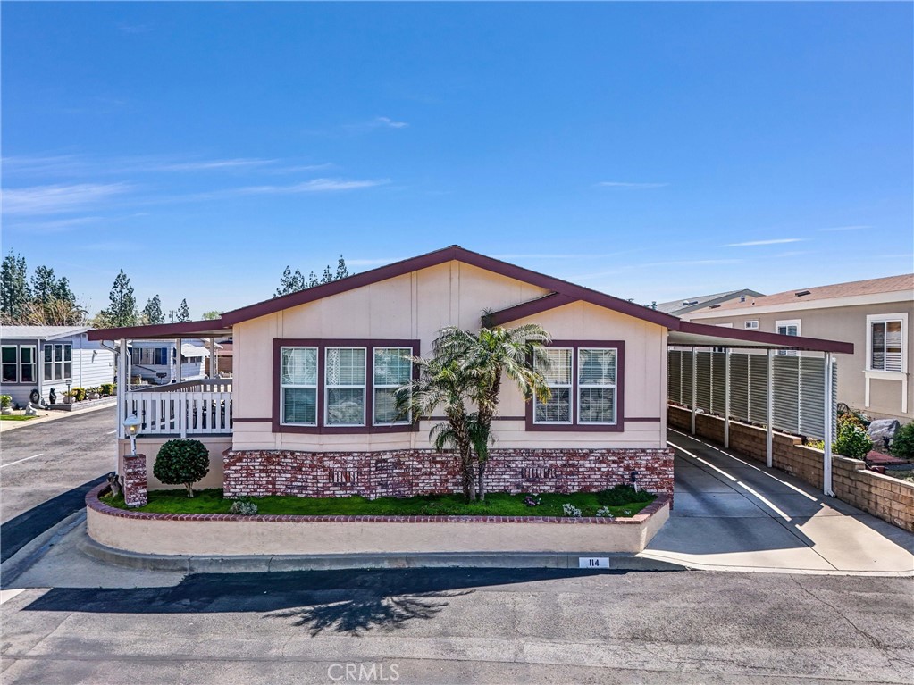 Welcome to Chaparral Heights – A Sought-After 55+ Community in Alta Loma/Rancho Cucamonga with one of the lowest space rents in the city at just $850 per month!! This beautifully maintained 2005 turnkey home features 2 bedrooms, 2 bathrooms, and is ideally located on a desirable corner lot—one of the best spots in the park! Step onto the charming covered front patio, perfect for relaxing mornings or afternoon chats. Inside, you’ll find a spacious living room, a separate dining area, and a generously sized kitchen with a breakfast nook, stainless steel appliances, and plenty of cabinet and counter space. The primary suite includes a walk-in closet and a private ensuite bathroom with dual sinks, a linen closet, and a walk-in shower. There’s also an indoor laundry area for your convenience. Outside, enjoy a large covered carport featuring a brand-new privacy wall and electric lift—making access to your home effortless. The property also boasts a NEW 3D composition roof for added peace of mind. All of this is nestled in a well-maintained, exclusive community with low space rent. Plus, residents have access to RV parking on-site—an incredible bonus! Community amenities include: sparkling pool & spa, clubhouse and recreation center and billiard room. Convenient access to shopping, dining, and major freeways. Homes in Chaparral Heights are rarely available—don’t miss your chance to own this exceptional property!