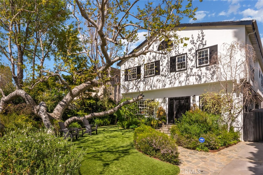 Unbelievable opportunity to own this totally remodeled 2-story Traditional. The front yard greets you with lush landscaping bursting with flowers and a 100-year-old sycamore tree. The entry is large with high ceilings flowing to the living room and dining room. Living room has a fireplace and a huge window overlooking front garden. The dining room easily seats 12 and has built-in custom cabinetry and built in wine refrigerators. The family room / media room has high ceilings and is large with built-ins and casual dining. French doors open to a truly magical backyard with pool, outdoor fireplace, outdoor theatre, dining area, lush landscaping with total privacy and multiple entertaining areas. The kitchen is remodeled with Carrera marble, center island, a wall of built-in cabinets/pantry, and breakfast seating area that opens to the dining room. The ADU is brand new with a kitchenette, built-in desks and floor-to-ceiling storage cabinets with French doors that open to the outside dining area. Upstairs are 5 rooms. The primary spans the entire front of the house with large windows and high ceilings.. There's a large sitting room that could be an office, nursery or playroom and a large bedroom with a fireplace. Primary also features a remodeled bathroom with duel sinks, soaking tub, steam shower and 2 sizable walk-in closets. Off the center hallway are 3 additional bedrooms. 2 of them are medium sized and share a large hallway bathroom. The 3rd is a junior suite with a large bedroom en suite and walk in closet. This home has tons of light, high ceilings, hardwood floors throughout, gated driveway with covered electric awning the length of the driveway, new lush landscaping and outdoor lighting and located on the best street between Sunset Blvd and San Vicente in Brentwood! There's a private dedicated 24 hr/ 7 days a week security guard for Anita, Medio and Carmelina. ALL wires have been put underground . Some furniture could be available.