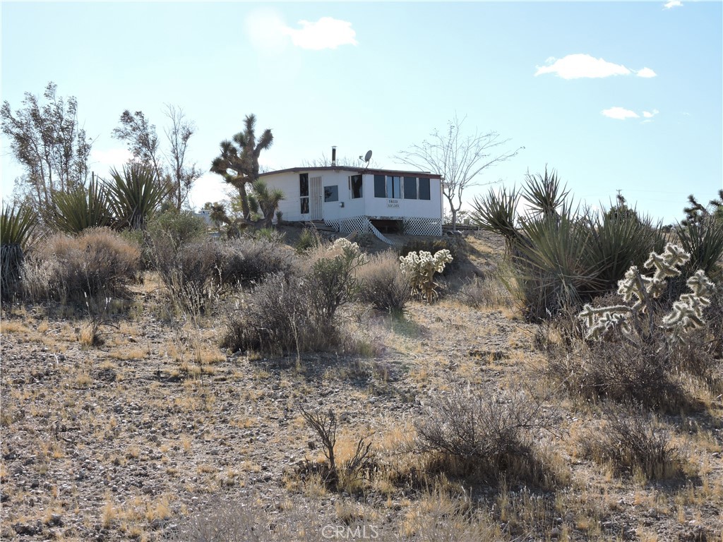Diamond in the rough with Beautiful Views on 5 Acres! Bring your paint brush and elbow grease for this fixer with lots of potential! Use your own creativity and make this your own special desert get away. This home is not far from the Joshua Tree National Park, Pioneertown, and a short drive to Palm Springs. Priced to sell!