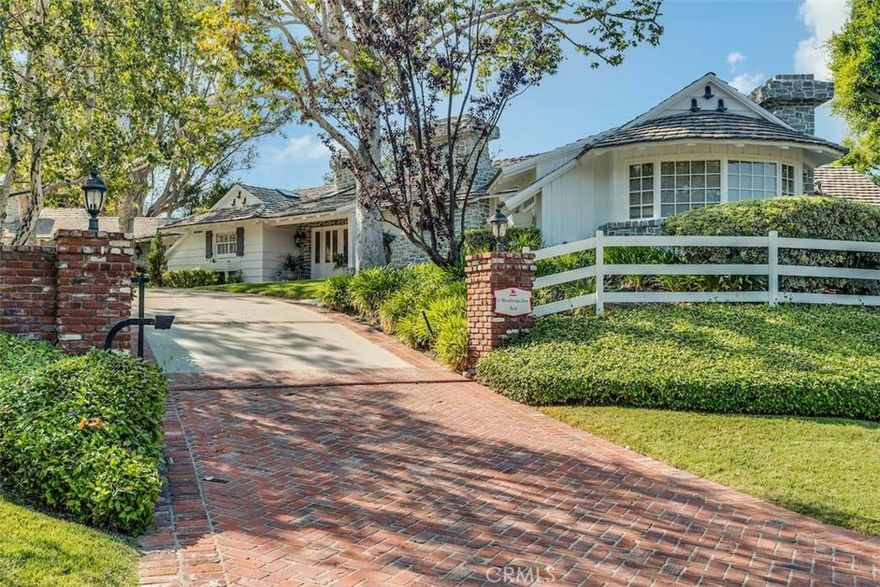 An incredible property located in the most prime and exclusive section of Rolling Hills, featuring a sprawling, one story, completely remodeled to perfection, modern Ranch style home. Five private bedroom suites all with their separate wings, wood paneled office, huge formal dining room, refrigerated wine room, large family room with 70" flat screen with surround sound, Formal living room with high beamed ceilings and a separate luxury guest house.  There are four fireplaces, many skylights, new hardwood floors, and designer touches throughout.  The master suite has an enormous walk-in closet, a private sauna, and a spa like shower tub combo that rivals the finest 5 star hotels.  The fabulous grounds also have a separate air conditioned gym, 6 car garage, a workshop, and a lower driveway to additional parking.  The sparkling pool and separate spa are like a water park oasis.  There is a also a huge outdoor party palapa with multiple TV's that fold down from the ceiling by remote control and seating for 20!  Enter this lovely estate through a set of private gates to an awesome circular motor court surrounded by beautiful mature landscaping, gorgeous t