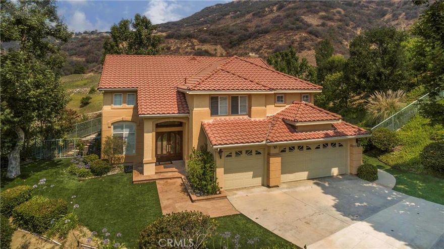 Welcome to this gorgeous, stately home in Stonegate. Meticulously maintained-details & upgrades abound thruout! Beginning at the dble dr entry, right thru to the stunning backyd, & everything in-between. Step into the 2-story frml entry w/dramatic curved staircase & u realize this is only the beginning.  Step-dwn LR w/soaring clngs opns to the FD inviting gracious entertaining. Grmt kit inclds grnite cntrs, 6-burner Wolf range, sep convec oven, gorg cabnts, bkfst bar & din nook, opening to the FR w/ stone fireplc, & blt-ins. Rounding out the dwnstrs is an upgrded ba & bedrm(currently used as an ofc) & lndry rm w/direct access to the 3 car gar. Upstairs are 2 add bedrms, upgrded ba, bonus rm/loft + a wnderful mstr ste w/ dble dr entry,balcny & redone en-suite ba, which includes dble sinks, sep tub & shwr & a wlk-in clst. As you head to the backyd you'll be in awe of the vu of the mntns, the lush lndscaping, the huge cvered patio perf for alfresco dining, blt-in bbq, & stone edged pool/spa w/ beach entry. Add'l amenities include recessed lts, ceiling fans, plantation shutters, wd blinds, wide basebrds, sec sys, 2nd a/c sys & upgraded elec. This warm, inviting home offers a comfy indr/outdr lifestyle to delight you. All this plus El Camino High district too!