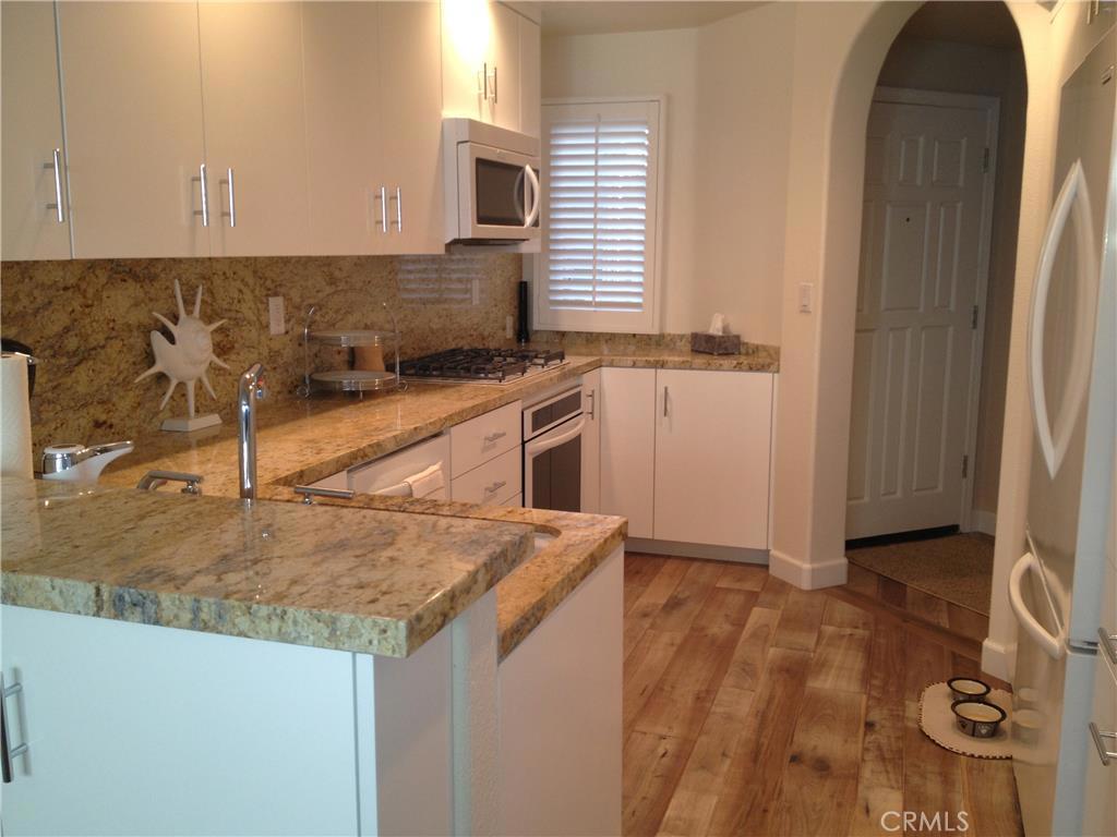 Rarely available, model perfect with over $70,000 in recent interior upgrades in the meticulously maintained community of Bluffside Villas. This home is in the coveted section of Dana Point, just above the harbor, and south of Coast Highway in the newly renovated Lantern District.Presenting a tremendous value for this location, the home features an abundance of custom features throughout to include:New Gourmet kitchen Euro cabinets,with stainless steel finishes, gorgeous granite tops and all new top of the linw appliances. New solid wood Tuscan Lucca floors with Cape Cod finish, all new energy efficient windows and all new E-piping solid copper plumbing . All bathrooms have been upgraded with beautiful new fixtures and energy efficient plumbing. The association has newer 50 yr. Presidential Shake roofs and James Hardy 35 yr. concrete fiber siding. Walk to all the new Dana Point Downtown in minutes.