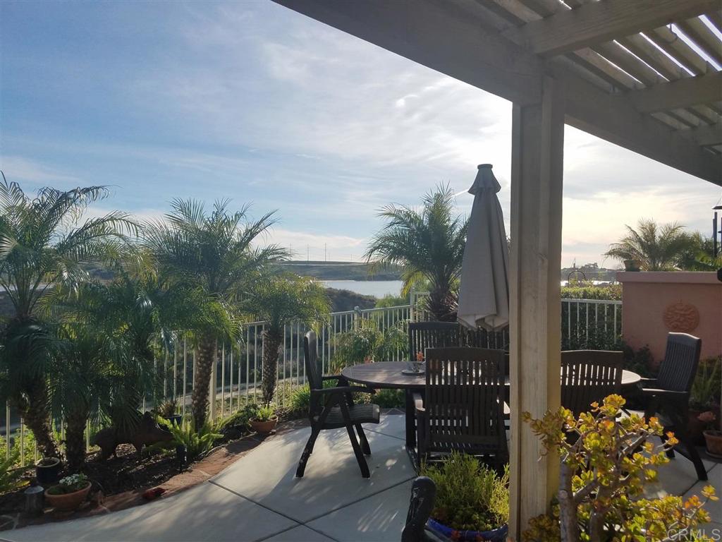 TAKING BACK-UP OFFERS!!! Beautiful SINGLE LEVEL home in desirable Laguna Del Mar. Fabulous lagoon/estuary views upon entering. Kitchen upgrades including granite counters, country cabinetry, Porcelain tile flooring & AC. Kitchen offers newer appliances & spacious pantry. Vaulted ceilings in DR, LV and Master. Master opens to patio w/ great VIEWS. Master bath enjoys Porcelain tile floors and tile shower, dual sinks. Lovely patio w/newer hard-scaping and mature plantings.
