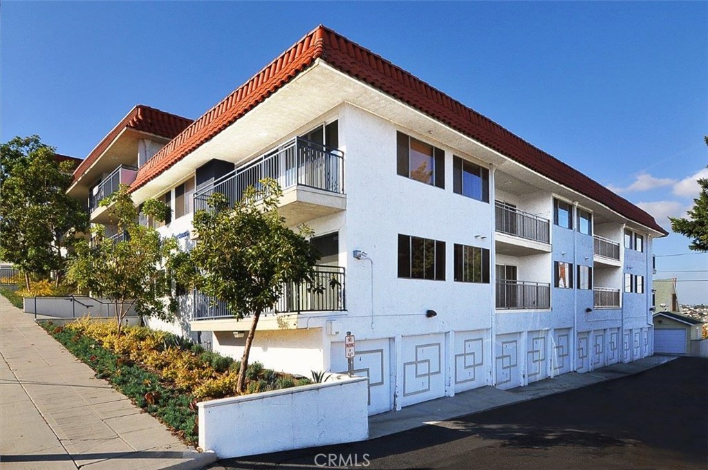 BROKER/BUYER PROPERTY TOURS January 12, 2017 between 10am and 2pm. CALL TO CONFIRM A TIME.
The Pacific View Apartments - A 30 unit apartment building located at 740 W 24th St in San Pedro, presently owned and operated as furnished student housing by Marymount California University who is also the seller. The complex is situated on a hillside lot totaling 21,257 square feet with views of the harbor and breakwater as well as affording some city lights views from many units. The parcel is zoned RD2-XL which permits one dwelling unit for each 2,000 square feet of land. Current zoning would not permit the addition of any more units nor would the existing density of 30 units be permitted for a new development. However, the existing use and number of units is grandfathered and considered legal non-conforming. The improvements consists of 28 two bedroom units and 2 singles situated around a center courtyard within 32,977 square feet of building area (per assessor's records). There are 28 parking garages with approximately 41 spaces, of which some are tandem. There are two more tandem garages that are being used for storage and utility closets.
San Pedro is a community within the city of Los Angeles. Formerly a separate city, it consolidated with LA in 1909. It' s a unique blend of small town charm, superb cultural attractions, eclectic shopping, America's Port and a world class cruise center.