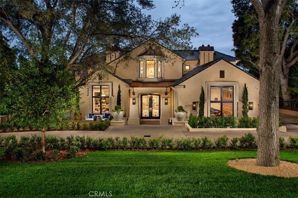 Stunning and Luxurious Brand New Construction on one of Arcadia's best streets! Elegance, comfort, and function combine for high-class 21st-century living! Designed by Robert Tong, Built by Bowden Development and developed by Rykadan Intl, creating this breathtaking home where effortless style and class are on show. This property sets the new standard for Global Luxury in all the San Gabriel Valley and is not to be missed. Lush landscaping surrounded by mature trees draws you in to discover a sophisticated front entrance with grand double doors beneath a striking bay window to invite you inside. Enter into the dramatic foyer where high ceilings, a dazzling chandelier, and gleaming marble floors create an opulent welcome to set the tone for the expansive open floorplan. Neutral color tones and hardwood-style floors are brightened by an abundance of natural light illuminating from the many large windows. Kitchen made stylish by sleek quartz details from the backsplash, to the countertops, to the waterfall island featuring a breakfast bar underneath a chic light fixture. Plus, there’s ample storage in the attractive combination of white and wooden cabinetry, a large built-in fridge, and high-quality stainless steel appliances. Enjoy casual dining in the adjacent informal dining room or impress guests w/epic meals in the formal dining room underneath the sparkling chandelier. Get cozy by the fireplace in the living room after dinner, have a movie night in your private large movie theater, or enjoy cocktails and conversation under recessed lighting in the spacious family room. Your extravagant upstairs master suite provides french doors leading out to a private balcony and a trendy sliding barn door leading to a reading room. Plus, there’s a walk-in closet, a jaw-dropping ensuite highlighted by an oversized walk-in steamed shower, dual sinks, and a stand-alone tub beside bay windows for relaxing in the utmost style. Your resort-style backyard oasis showcases a shimmering pool and spa surrounded by beautiful landscaping and palm trees for a tranquil space to entertain. Additional features include a loft under multiple skylights, a wine room, an elevator, main level executive office, second wok kitchen, a laundry room, a gym w/a sauna and full bath, an attached three-car garage, and you’re close to dining, shopping, entertainment. This idyllic lifestyle in the prominent Upper Rancho neighborhood awaits you, close to the Award winning Arcadia School District.