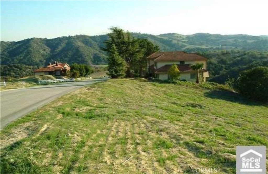 Stunning, flat and usable prime piece of vacant land located in THE COUNTRY ESTATES!! Discover the canvas for your dream home on this pristine 1.455 Acres vacant lot. Nestled in an exclusive guard-gated community, the expansive land offers a blank slate for your architectural vision. With breathtaking mountain views as your backdrop, envision a residence that seamlessly blends luxury with natural splendor. This lot presents a rare opportunity to craft a home that complements the majestic surroundings, creating a haven of tranquility and sophistication.