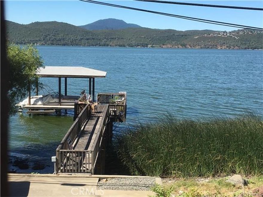 Best Value on the Lake!  Beautiful lakefront home ready to move in and enjoy.  Excellent views of lake mountains and Konocti.  Dock and Boatlift/jet ski lift, with year around access deep water!  Room for all your toys.  Garage with extra storage.  Spa with amazing views on deck with large retractable awning.  Large living room open dining room and kitchen.  Just minutes to downtown Clearlake.