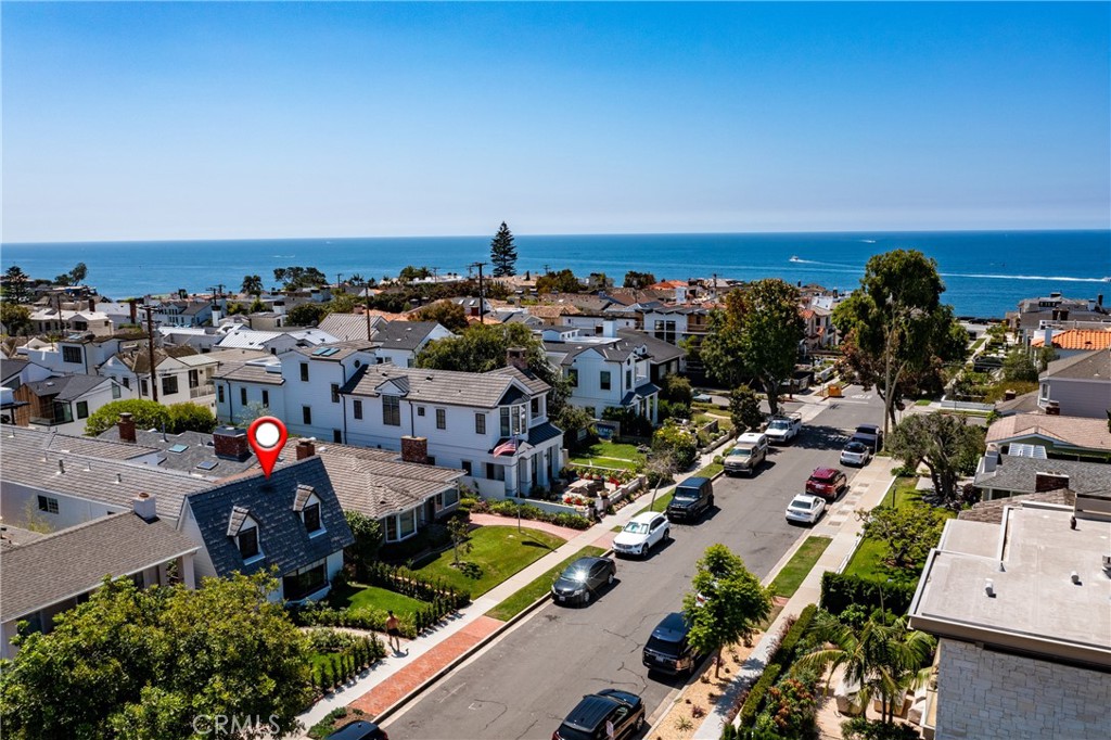 Coastal Living At Its Best At This Stunning Recently Remodeled Corona Del Mar 5 Bedroom 5 Bath Beauty - The recent remodel features an open concept great room with a spacious living area & dining room open to a gourmet kitchen with soap stone & marble counters & back splash, large island, Restoration Hardware lighting, Wolf range and Thermador appliances including a built in espresso/coffee maker and refrigerator. Elegant French Oak wide plank floors recently installed throughout the property. LaCantina Bifold doors open up to your private yard perfect for entertaining. Exquisite French Oak wide plank flooring recently installed throughout the property. The main floor features an additional living room and a main floor bedroom & bath. The primary bath has a gorgeous freestanding tub & marble shower with Restoration Hardware fixtures. All bedrooms feature en suite bathrooms. The large bonus room/5th bedroom features a walk in closet & balcony. Dual unit air-conditioning recenlty added. Two car garage plus gated side yard with additional parking available in the rear of the property. Located on the ocean side of Coast Highway, this fabulous property is close to the breathtaking views at Inspiration Point & offers easy access to the beach and world class shopping & dining.