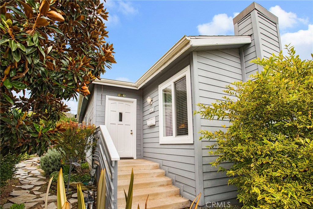 3 BEDROOM, 2 bath, SINGLE LEVEL, DETACHED condo that sits like a single family home all on it's own corner. Located in the "Tree Streets" of beautiful North Laguna, this is the beach cottage you've always dreamed of in the perfect location. A short walk from downtown Laguna and all Laguna Beach has to offer. Enter the spacious living/dining/family room with original oak hardwood floors just beautifully refinished. New paint, new floors, new window coverings and a fresh look everywhere. Large living room with a cozy feel includes gas fireplace and beamed ceilings. Sun streams in throughout the property with loads of natural light through newer windows & sliders. Sliders from living room and secondary bedrooms open onto large, private deck. Master bedroom is roomy with romantic fireplace, corner windows & walk-in closet. Master bath has tiled walk-in shower & dual shower heads. Secondary bedrooms are spacious & offer excellent home/office space. Kitchen is filled with light & looks out onto beautiful garden setting. Kitchen includes butcher block center island with storage, Kitchen Aid double ovens and double door refrigerator. The spa is close by located just steps away from the Ocean View deck. Plenty of parking included with 2 separate 1 car garages including storage plus carport right outside the kitchen door. Excellent location for walking to beautiful beaches, restaurants, shopping and the heart of Laguna Beach.