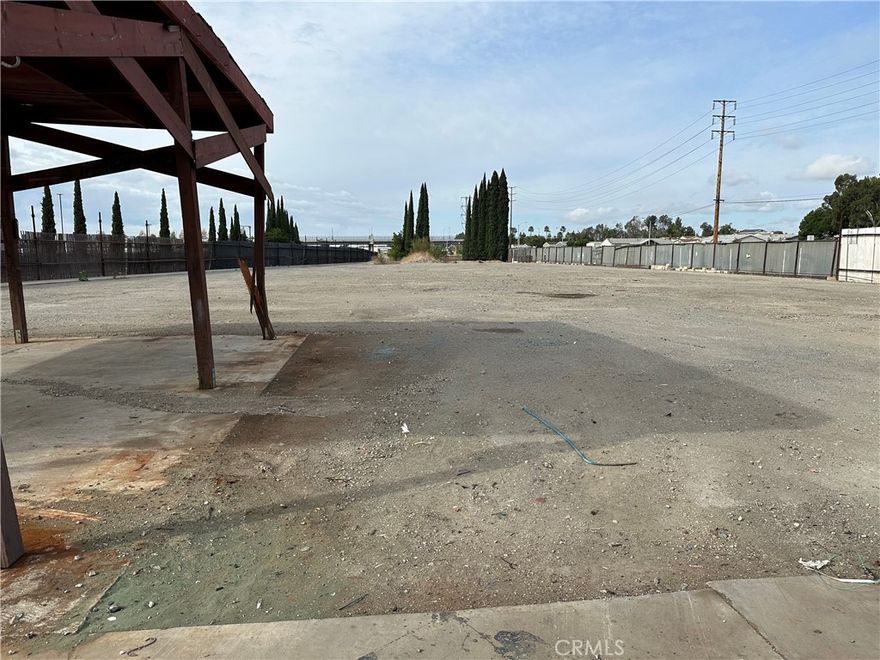 Lot containing an active oil well and approximately 55,191 square feet of land. Fenced lot surrounded by RR Tracks and Flood Control Channel. Close to the 91 and 57 Freeways.