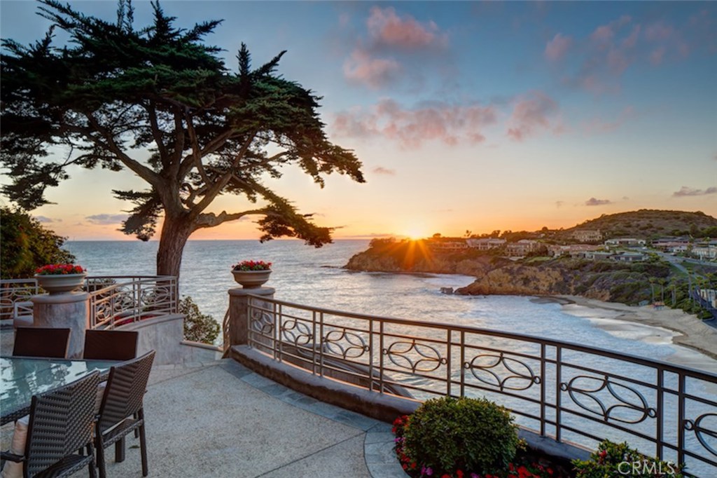 This spectacular Emerald Bay oceanfront residence features panoramic views of the ocean, sunsets, and crashing whitewater below from its dramatic cliff top setting. Occupying one of the largest parcels in Emerald Bay with nearly 100’ of ocean frontage, the residence is positioned to capture dazzling views from every major room. The unique topography of the lot gently descends toward the water’s edge, with spacious terraces and gardens as well as a private spa overlooking the cove. Through a private gate, the waters of the cove below are easily accessed. The home is a warm blend of contemporary design with dramatic volume (near to 20’ in some locations) and walls of glass opening to the vistas. Honed limestone, bleached woods, and crisp white walls combine to make perfect rooms with expanses of glass framing the azure waters. Approximately 7,100 square feet of living area is designed for comfortable living, to maximize views, and proves an inviting plan for entertaining as well. The main public areas are all generously proportioned and open to spacious terraces set spectacularly above the water. The wonderfully private master suite encompasses almost an entire floor and opens to an intimate sunset terrace. The secondary bedroom suites are light, comfortable, private, and enjoy sea views. The view frontage, combined with the setting and extraordinary size of the residence, make for a compelling opportunity. This is simply not to be missed.