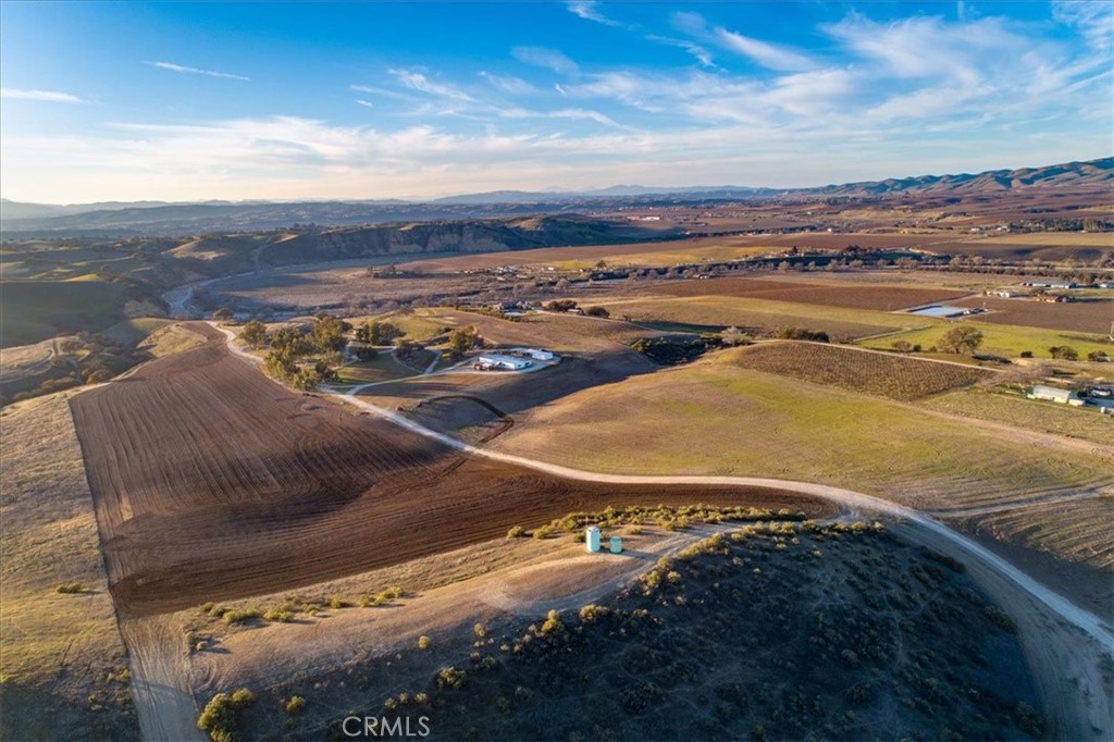 Welcome to Dancing Tree Ranch. This stunning property is comprised of 67+ prime acres and is the last acreage of this size on Airport Rd. Ideally located in the heart of wine country yet only minutes away from the airport, shopping and downtown. The gentle topography lends itself to a variety of uses and it would make a wonderful horse ranch with its easy access to the Estrella Riverbed. 15 acres are currently being dry farmed for hay with ample covered storage. The property has a good well and is comprised of 2 legal parcels. Enjoy the park like setting with its many eucalyptus trees, well groomed land and picturesque panoramic views. Come build your dream estate on this slice of wine country paradise!