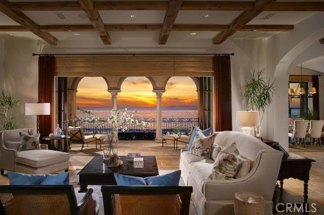 Rare to come to the market, this breathtaking oceanfront estate is located on an oversized lot at The Strand, one of Orange County’s most coveted guard-gated communities. Boasting nearly 9,000 square feet of pristine architecture, this striking estate offers every lavish amenity to satisfy those with the most distinguished taste. Upon entrance into the estate, you are instantly captivated by the meticulous attention to every detail, including the hand-carved beamed ceilings, custom stone flooring, and wrought-iron staircase connecting each level of this impressive property. Ocean views spanning beyond Catalina Island abound from nearly every state-of-the-art room, including a grand kitchen equipped with designer appliances, an extravagant Great Room with vaulted ceilings, and five spacious bedrooms ensuite with gorgeous bathrooms. This estate offers the ultimate venue for entertaining, as it is graced with extravagant outdoor living spaces complete with an infinity pool and spa, outdoor fire pit, and stone terraces. The private neighborhood beach club offers a resort-like pool, fitness center, private lockers and world-class dining. Don’t miss the opportunity to own one of the community’s most prestigious properties!