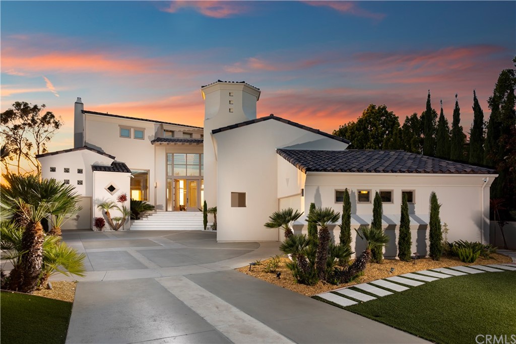 CASA ROYALE one of the few Contemporary/Modern houses in the area. IT HAS VIEWS VIEWS VIEWS! Situated on a coveted cul-de-sac parcel in the highly desirable community of Pelican Ridge; a 24 hr security gated community. This custom family home makes a dramatic first impression and enchants throughout with extensive views of the ocean, Catalina Island, city lights, and Newport Harbor and on a clear day downtown Los Angeles meanwhile two minutes to PCH and a Grocery Anchored shopping center. Abundant natural light floods the open floor plan accommodating four bedrooms, Four Full Baths and one Powder and a one-half Pool bath, including one with separate access; perfect for an au pair. The formal living room and dining room overlook the stunning ocean views, adjacent a gourmet kitchen with Gaggenau: Steam Oven, Conventional Oven, Electric Cooktop. Miele: Coffee Maker, Speed Oven, TeppanYaki Grill, Warming Drawer, Large Freezer and Refrigerator side by side and Dishwasher. Fisher Paykel: Gas cooktop, dishwasher. DID I SAY IT HAS A GOURMET KITCHEN!? (please see supplement) that opens to the family room and patio beyond. Up a few steps is the large Theater with a Bar area then there is an upstairs master retreat/suite with separate sitting area, Spa like Master Bathroom with Kohler infinity edge soak tub and a Kohler fully computerized shower with Mr Steam and speakers and large terrace with enchanting views of the ocean, city lights and harbor. Two additional upstairs bedrooms with ensuite baths. No expense was spared and only the finest materials where used. (see supplement) The home is situated on a 13,757 square foot lot highlighted by abundant patio, pool and spa, garden and fruit trees. Four-car garage and a single car garage.