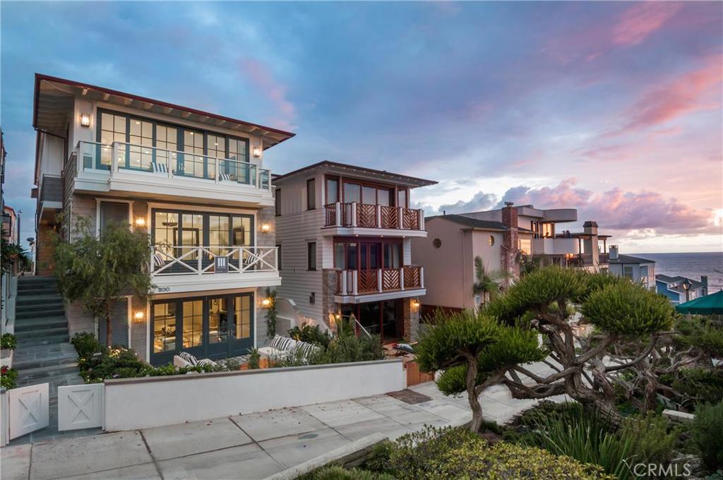 This one of a kind Cape Modern Home built by Matt Morris Development is a blending of modern and traditional materials. Located on one of Manhattan's finest walkstreets a short walk to town or the beach. The home features 4 bedrooms, 4.5 baths in 4150 sq.ft. The top floor boasts a dynamic floor plan with two large family rooms, a large outdoor room/entertaining deck an extraordinary gourmet kitchen, three fireplaces (one outdoor), terrific ocean views to the northwest/southwest. The kitchen features a large gourmet island with waterfall edge, Wolf pro-range,custom stainless vent hood, 2 side by side Subzero integrated refrigerators,Meile coffee maker and wine cooler. The best new construction amenity package ever for a walkstreet home including Waterworks plumbing fixtures, Vantage Lighting controls, multi-zoned air conditioning, high end custom lighting from Urban Electric, fully integratedaudio video savant system, 7" wide plank white oak flooring throughout, full slab walls in master bath, 3 stop elevator, refrigerated wine cellar, bluestone on all decks and walkways, steam shower and more. Spacious beach room and walkstreet patio featuring custom concrete tile which blurs the distinction between indoor and outdoor space.