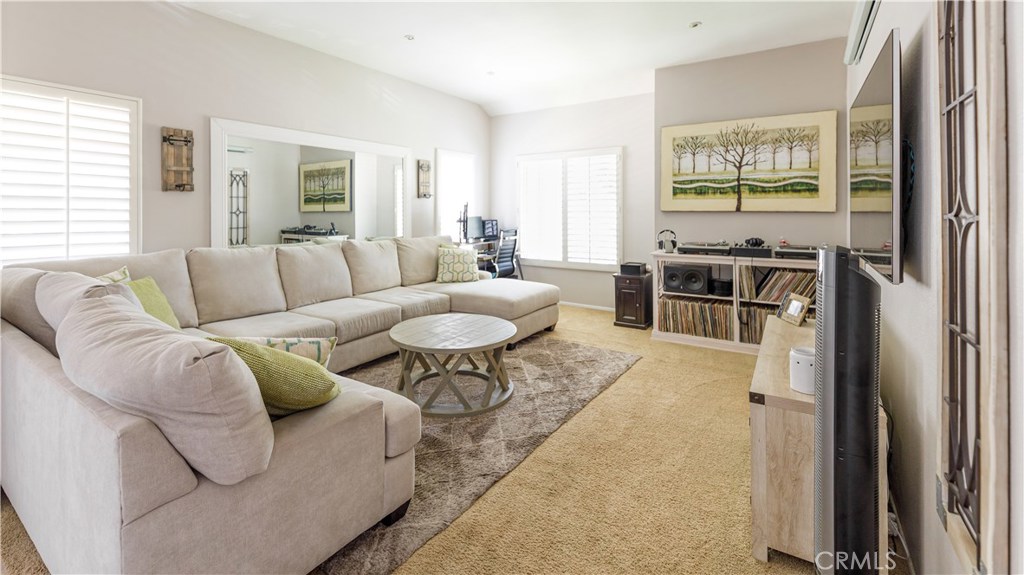Welcome Home to one of Irvine's Finest Communities at Woodbridge. Beautifully upgraded to the nines with no expense spared, this very private upper level condo is a light and bright open concept dream. The elegant kitchen has updated bright white cabinets with great contrast to the lustrous granite counters with custom backsplash. The hall bath has a designer vanity with glass basin top and crown molding, and the roomy master bath suite with elongated granite-topped vanity has double sinks with plenty of space for storage. The seller has added charming touches like recessed living room ceiling lights and plantation shutters, too. Close to all the great amenities in central Irvine, the wonderful Woodbridge community offers access to 22 community pools, two great lagoons and lakes, numerous peaceful parks and lakeside walking trails.