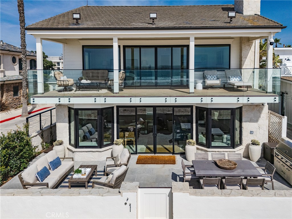 Welcome to 6110 W. Oceanfront, a stunning beach house right on the sand in the heart of West Newport. This 40-foot corner property offers panoramic Pacific Ocean views and spectacular sunsets from every angle. Recently renovated, the home features an open floor plan that’s perfect for entertaining, with 4 bedrooms and 4 bathrooms, providing plenty of space for family and friends. The custom finish carpentry throughout adds a touch of elegance and craftsmanship. Ideally located, this home is just minutes from the best dining, shopping, and recreation that Newport Beach has to offer, including golf courses, yacht clubs, and luxury spas. This incredible oceanfront property is one of the best lots in a premier location on the Peninsula and is truly a must-see!