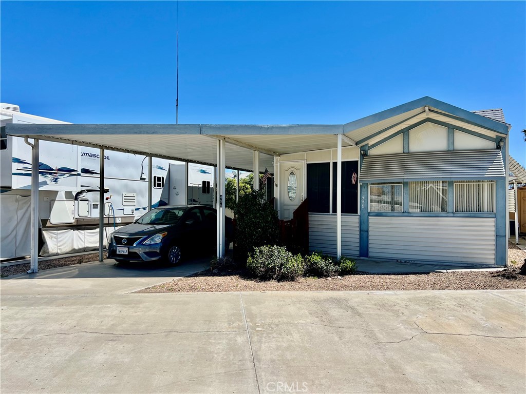 OWN YOUR LOT! Desired Mt Shadows RV Resort Gated 55+ Senior Community. Large "A" Lot Approx 2,178 Sq Ft. 1993 Park Model! The Full-Length Enclosed Patio Room Could Be Used As A Family Room, Den Or Second Bedroom. Kitchen With Propane Gas Cook & Oven, Microwave, Garbage Disposal & Lots Of Cabinets For Extra Storage, Wood Flooring Throughout Open To The Living Room With Custom Window Coverings. Enter The Bathroom From The Hallway Or Bedroom And Has A Step In Shower, Vanity Sink & Top To Bottom Linen Closet. Bedroom Has Mirrored Wardrobe Closet Doors & Built-In Cabinets & Ceiling Fan. Improved Storage Shed With Washer & Dryer. Back Yard With Vinyl Fencing At The Back Of The Property For Privacy & Fruit Trees. Covered Carport Could Park Two Vehicles. Two Clubhouses To Choose From One With Lots Of Amenities Including Heated Salt Water Pool, Spas, Billiards, Shuffle Board, Picnic Areas, Large Community Kitchens, Exercise Rooms, Restrooms And Showers, Laundry Rooms, Horse Shoe Pit, Ping Pong Tables, Corn Hole And More. LOW TAXES & HOA FEES Of 243.65 X Month Includes Water, Sewer, Trash, Basic Cable & Internet. Retirement At It's Finest!