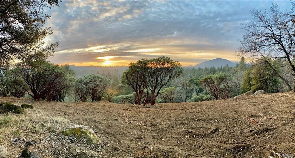 VIEWS VIEWS VIEWS.SELLER WILL CARRY WITH ONLY $15K DOWN. Monte Vista is a very Gorgeous neighborhood just above Triangle Road at a perfect mountain elevation just minutes from the historic Mariposa village near YOSEMITE. Over the hills and through the woods you will arrive at the magical VISTA LAGO, and I can certainly say you will find no other area here like this. Paved all the way to your stunning, CLEARED 5 acre parcel with its grand moss covered granite boulders, pines, oaks, mazanitas and a lovely seasonal creek. Its DREAM HOME site indeed considering you can barley see any other homes near by due to the very spacious lot sizes here. You might also see hawks and many other various types of birds flying over head as well as an abundance of healthy beautiful wildlife about. Come on up to see how this stunning one of a kind property will make your heart skip a beat knowing you can build your brand new home here with outstanding VIEWS and be able to really LIVE Above it All. SELLER WILL CARRY.