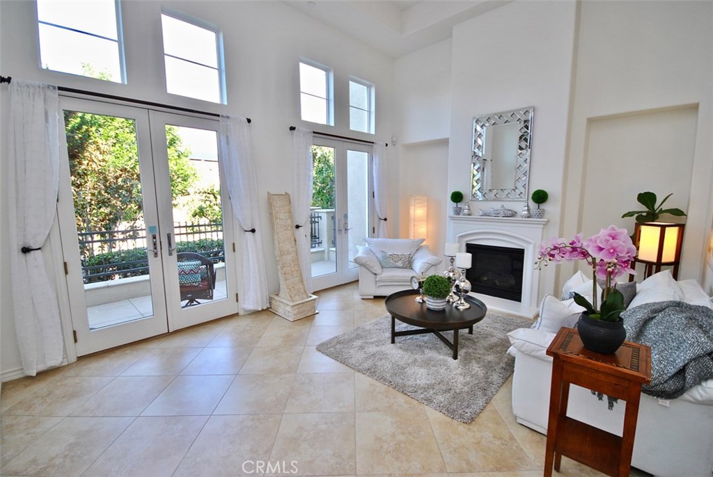 Stunning,Gorgeous Contemporary Home Located in Exclusive Quiet and Private Columbus Grove within Prestigious Irvine School District.Home Features: Charming Front Patio,Open Floor Plan,Vaulted Ceilings,Chef’s Dream Kitchen with Island,Beautiful Tile/Hardwood Floors,Plantation Shutters,Custom Blinds,Tray Ceilings,Recessed Lighting,Dual Pane Windows,French Doors & an Abundance of Natural Light.Entry Leads to Formal Living Room with Custom Fireplace,Entertainment Niches & Double French Doors that lead to Spacious Front Patio.Large Formal Dining Room with Tray Ceiling is Perfect for Entertaining.Gourmet Chef’s Dream Kitchen with Beautiful Granite Counters and Backsplash,Oversized Island & Breakfast Bar,Stainless Steel Appliances & Rangehood & Built-in Wall Oven/Microwave.Kitchen Opens to Huge Family Room with Dark Cherry Hardwood Floors.Retreat to the Massive Master Bedroom with Custom Blinds,Walk-in Closet & Beautiful Sunset Views.Spa-Like Master Bath with Tile Floor,Dual Vanity,Large Soaker Tub & Walk-in Tile Shower.Attached Large 2-Car Garage with Epoxy Flooring.Additional Features: Office Area,Large BR's,Upstairs Laundry Room, Dual Vanity 2nd BA,Built-in Cabinets.Sparkling Columbus Grove Association Amenities Include:Pool,Spa,Parks,Tot Lots,Club House & More!Conveniently located near Sweet Shade Park with sprawling picnic, child play areas & Gated access to popular Peters Canyon Trail.Close to Great Irvine Schools including UCI.DON’T MISS OUT ON THIS RARE AND EXCEPTIONAL HOME!