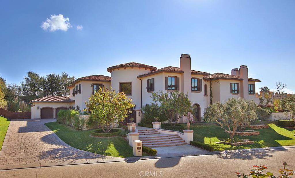 Enter into the two story rotunda with intricate mosaic tile floors, Venetian plaster walls, where custom iron doors open to the center courtyard patios. Boasting a wide open floor plan finished with details, including hardwood & stone floors, custom iron railings, moldings & trims, tumbled stone & slab granites & inlaid marbles. With six bedroom suites, stunning fully equipped gourmet kitchen-open to the wonderful family room, with full wet bar & fireplace, formal dining with seating for 12+ guests, wine cellar, paneled office, fully equipped theater and master suite with two large, fully detailed walk-in closets, fireplace, steam & spa, plus walk-out balconies. The expansive grounds include a lagoon style pool & spa, with Pebble Tec & salt water finish, waterfalls, cabana with fireplace, complete BBQ center, fountains, firepit, covered patios with electric heaters, and travertine patios that will accommodate large scale entertaining.