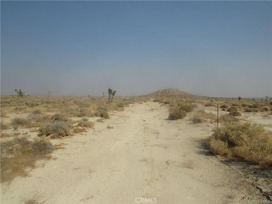 There is not an address associated with this parcel. What is reflected is the Parcel# 430-040-23-00-4 which is 2.56 Acres. Zoning is M-2 PD FPS. Located in the area of Mojave which is Unincorporated Kern County. Access via dirt Ericka Ave.