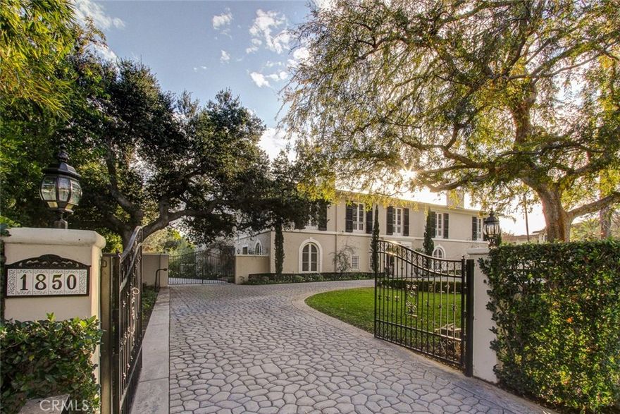 Situated within steps of the world famous Huntington Library & Botanical Gardens, this magnificent Colonial Revival masterpiece is an inspiring example of the work of renowned architect, Roland Coate.  This gated, private estate offers 7,439 square feet of gracious living space on a prime corner lot with manicured lawns, beautiful rose garden, pool & spa and splendid outdoor entertaining areas.  The main floor of the house features a grand parlor, formal step-down dining room, an elegant library and a large family room that adjoins the gourmet kitchen and light-filled breakfast area.  The second floor offers five luxurious bedroom suites and an inviting conversational sitting area under lovely skylights.  This remarkable home is an architectural gem.