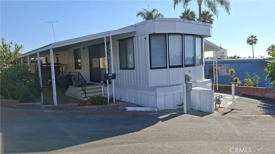 Affordable Treasure with Endless Potential in Vista Manor! Snag this budget-friendly single-wide mobile home on a prime lot in the welcoming Vista Manor community! Packed with charm and boasting stunning panoramic city and mountain views from the living room and spacious covered patio, this home is a steal for those ready to make it their own. Featuring a cozy bedroom with built-in cabinets and fresh carpeting, plus a generous bathroom with a separate tub and stand-up shower, it’s got all the essentials. The open kitchen flows into the living/dining area, offering a great layout for everyday living or hosting friends.Outside, you’ll love the attached covered carport for two cars, a large patio perfect for BBQs, and a lovely garden area with a shed for extra storage. Sold “as is,” this home is brimming with potential—roll up your sleeves and customize it to fit your style! Just steps away, enjoy the community’s inviting pool, clubhouse, and playground/park for endless fun.Location is a dream: minutes from shopping, schools, restaurants, freeways, train, and bus stations, plus a quick drive to the beach for walking, biking, or soaking up the surf, pier, and strand vibes. Whether you’re looking for an affordable full-time home or a budget-friendly weekend getaway, this Vista Manor gem offers incredible value and limitless possibilities. Act fast—this deal won’t stick around!
