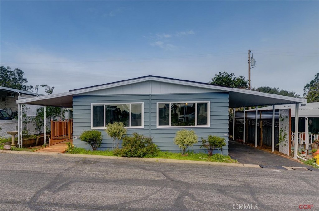 Sunny and spacious, this recently renovated two bedroom, two bathroom home is located in the tranquil Sea Oaks Mobile Home community. The open floor plan creates an inviting living space with abundant natural light. French doors open to a beautiful covered redwood deck, extending the living space into the charming backyard, with a wide variety of succulents, flowering bushes, and citrus trees. In addition to the renovated kitchen and bathrooms, all doors and windows were recently replaced, new floors installed throughout, new heater, and the roof was replaced only 7 years ago. Ideally located just a short drive from San Louis Obispo, Morro Bay & Cayucos, this beautiful area is famous for scenic beaches and wineries. Located just 10 miles from Montana de Oro State Park beach, where you can enjoy stunning views and hiking trails. One year home owner's warranty included. This home feels more like a custom home than a manufactured home. It is impeccable and not to be missed!
