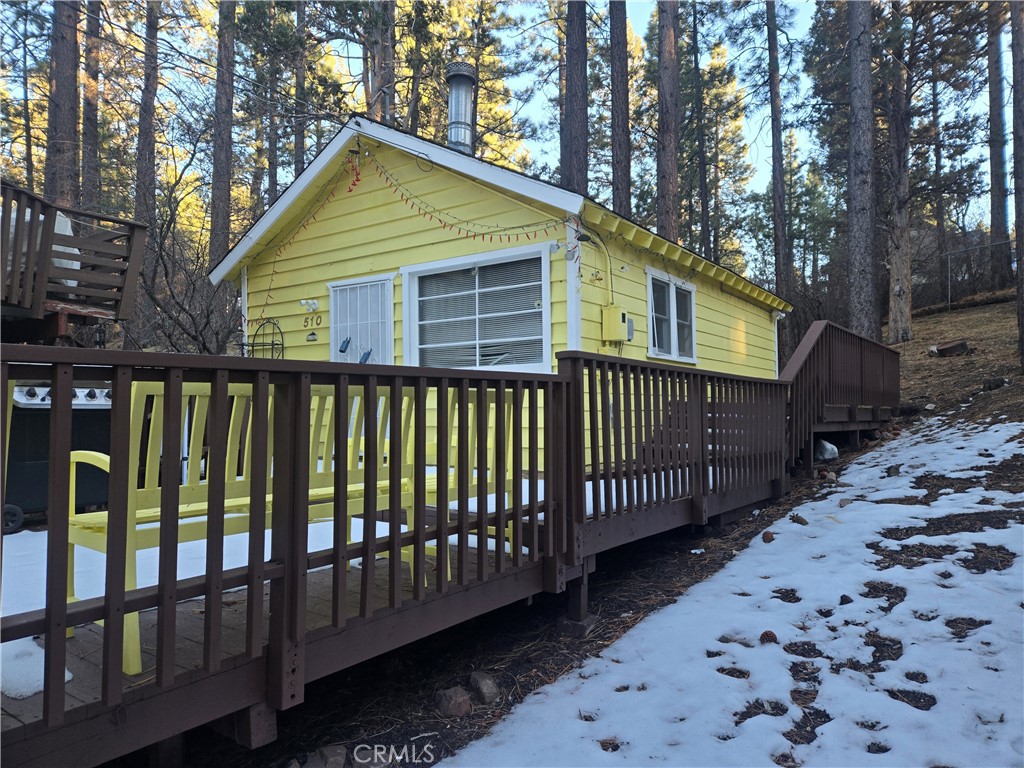 3450 sq' is More than a 25'x100' lot. There is room to add on to the front and the back, and yet there is a wilderness setting. Knotty Pine interior makes this sweet chalet cabin cozy and quaint. If you are a minimalist you can check off the boxes for this one. Loft is a great space for the kids or storage. Large front deck for total enjoyment of the outdoors, BBQ included. Extra deep lot. Crock Pot or Step Saver Kitchen super easy to clean. plenty of parking. Ample size bedroom with pull down stairway to the loft. See Attachments for lot line adjustments.