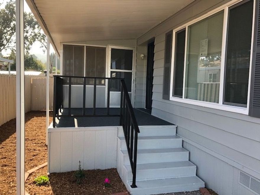Nice recently updated mobile home in all ages park, with land ownership. New paint inside and out, new double pane windows, new laminate flooring in living area, new carpeting in bedrooms. Nice stainless appliances in kitchen convey, as well as washer and dryer. Large shed in rear yard, and a raised planter bed for a small garden area.  Nice large carport and a good location with guest parking just across the cul-d-sac..  Neighborhoods: Mountain Shadows Equipment:  Dryer, Range/Oven, Shed(s), Washer Other Fees: 0 Sewer:  Sewer Connected Topography: LL