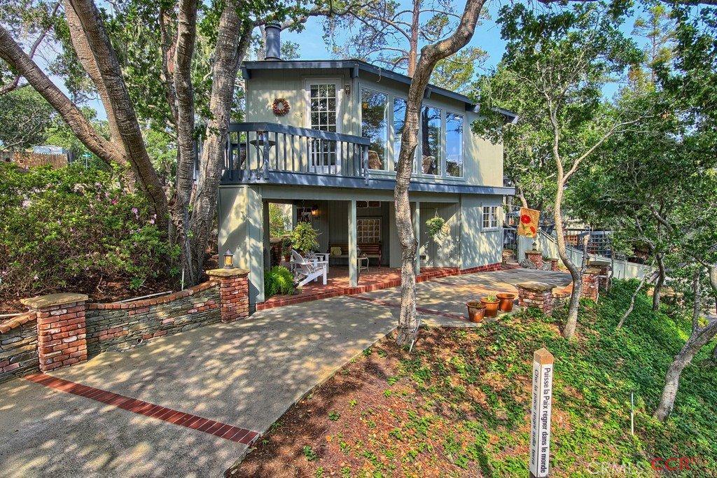 Gracious Coastal Living is yours at this beautifully appointed property w/serene tree-top views.Sited on a 1/4 acre parcel,this home offers 3 bedrooms & 2.5 bathrooms.The main living level features an inviting living room w/walls of windows & a fireplace.You'll love the fully renovated kitchen complete w/ granite counters, gorgeous cabinetry, stainless-steel Jenn Air appliances & pantry.The adjacent formal dining room is ideal for entertaining & features a handsome built-in buffet & French Doors leading to a charming deck overlooking the garden.The private master wing is a luxurious retreat complete w/library, setting area w/fireplace, updated ensuite bathroom & a separate exterior entrance leading to a gorgeous garden.Two comfortable guest bedrooms & an updated full guest bathroom are located at the lower living level, affording space & privacy. Multiple decks for outdoor living & a detached garage w/ample storage along w/an array of custom features-this immaculate home is a must see! Lot Description: Street-To-Street Parcel
