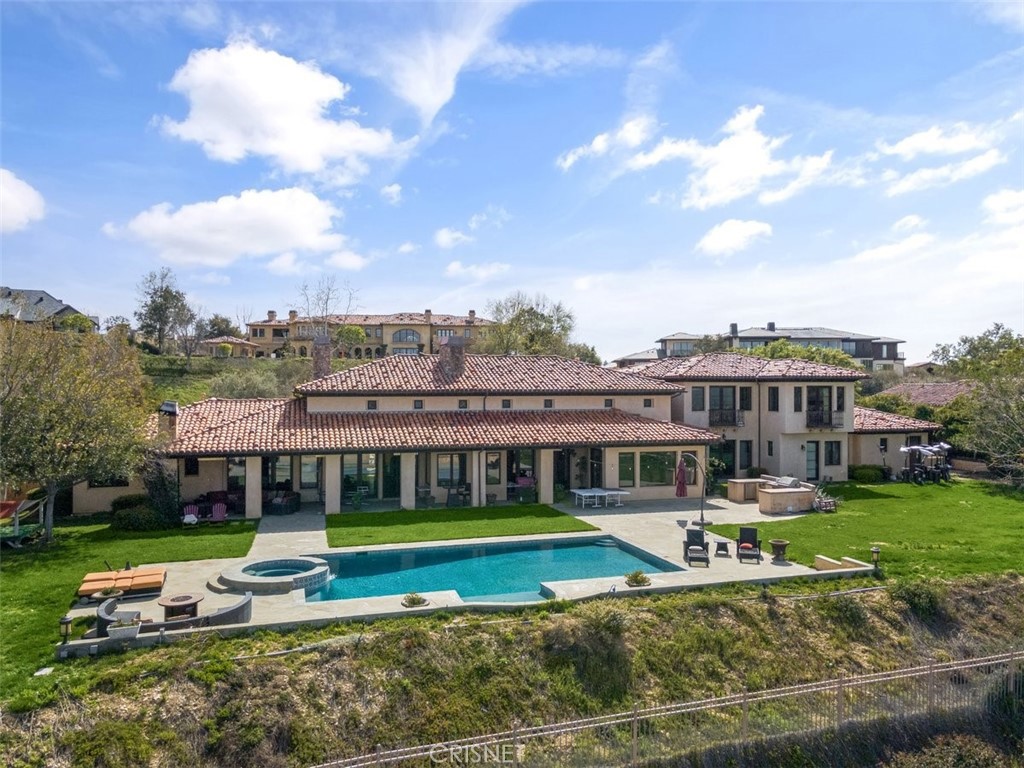 The Quintessential Calabasas Lifestyle Estate behind the highly coveted gates at The Estates at The Oaks. This Tuscan Villa Dramatic Entryway leads you into the wide-open floor plan with high ceilings, stone finishes, and incredible views. This refined Old World Estate has a spectacular largely single level floor plan with incredible scale and architecture. Beautifully crafted, this estate is approximately 8,226 sq ft of living space. Boasting features from a generous master suite with two walk-in closets, a large office, a spacious game room and home theater, an incredible family room open to the expansive grounds, and panoramic views. Incredible indoor and outdoor flow from every aspect of the property. Spectacular outdoor living at its finest. An attached casitas. The grounds are private and perfectly positioned for entertainment and retreat. A rare offering situated on the highest elevated street in the Estates with incredible views of the endless conservancy.
