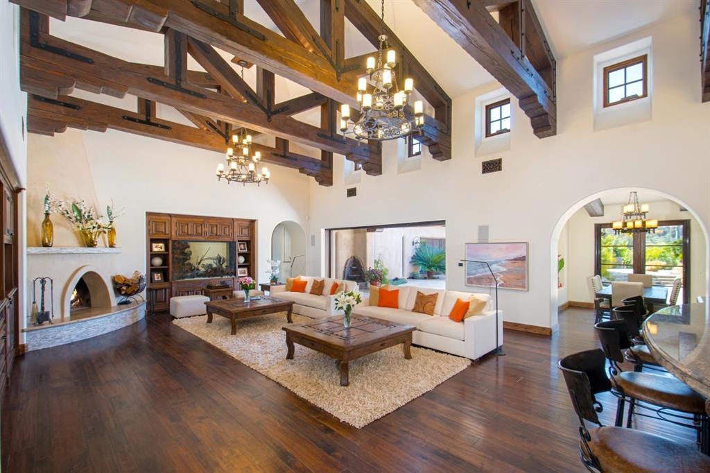 Presenting a Covenant Masterpiece where old world charm meets modern design all conveniently nestled on the west side of the RSF Covenant. Fashioned by distinguished international architects Bassenian Lagoni, this nearly 13,000 sqft Andalusian marvel was meticulously custom crafted for the highly discerning owner of a prominent real estate development company. See Supplement... Adjoining a protected natural wildlife preserve the estate offers supreme privacy complemented by serene views of open space and natural wildlife. Tasteful and elegant, the primary residence offers 8 generous bedrooms, and 10.5 baths. Custom walnut floors and cabinetry exude quality as do dramatic beams, hand-chiseled limestone, and trussed ceilings. This elegantly flowing primarily single level home lives conveniently around the massive open family room and incorporates an opulent multi-room master suite with a spa like retreat reminiscent of the Montage in Deer Valley. Equipped with a wet bar, over sized custom closets, and a lavish bath, dual steam showers, spa tub, and fireplace the master retreat is designed to pamper. An entertainer’s dream the magnificent kitchen perfect for culinary endeavors is anchored by a walk-in island, convenient prep kitchen, auxiliary catering kitchen, multiple pairs of Viking appliances, and an outdoor cooking island. Operational efficiencies include solar electric and pool heat systems, and “Smart Home” technology throughout. Marvel your guests with a destination 10 seat director’s theater room and performance stage, dine in stone walled wine cellar, conveniently located game room, and in-home gym. Steps away sits a detached guest house with 2 bedrooms, 2 baths and full kitchen. Sophisticated grounds offer a vanishing edge pool, large rear yard grass play area, multiple outdoor fireplaces, therapeutic water features including a large waterfall to the lower private courtyard, and a striking open beamed custom equestrian facility including four s...