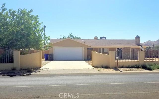 Here is your chance to own a spacious remodeled home in great condition. Perfect for growing families. Brick and iron gated, front shade trees, large open floor plan, tile floors, large living room and family room with 2 fireplaces, spacious kitchen with granite counter tops and back splash, tons of storage, clean appliances, 3 large bedrooms, upgraded bathroom with tile shower, walk-in closet, large backyard and much more! This home is a must see! Association Amenities: None # of RV Spaces: 0NONE Lot Location Type: Standard Location Landscaping: Natural Special Features: None # of Attached Spaces: 2 # of Detached Spaces: 0